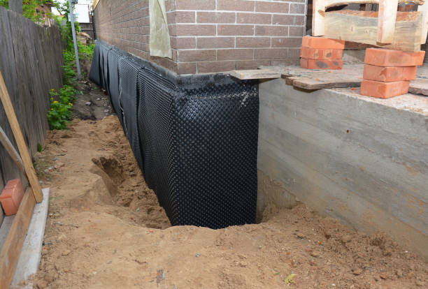 Happy homeowners after waterproofing job in Tuckerton
